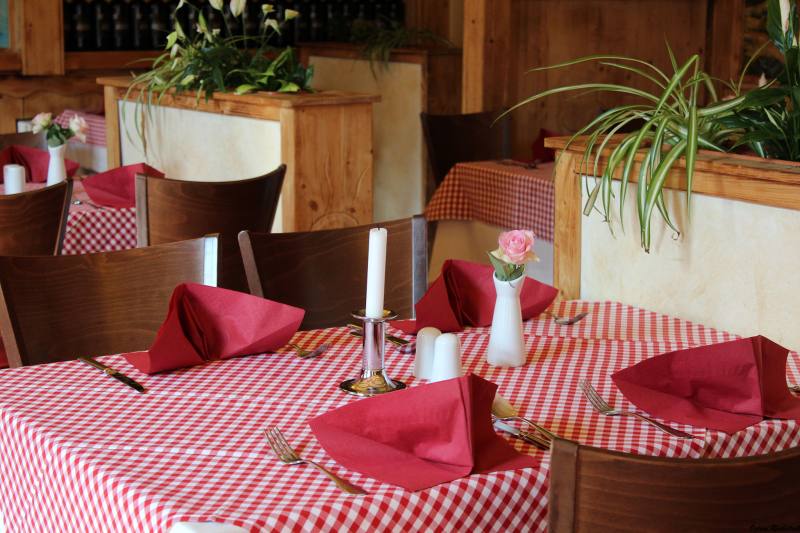 Laid tables with red napkins